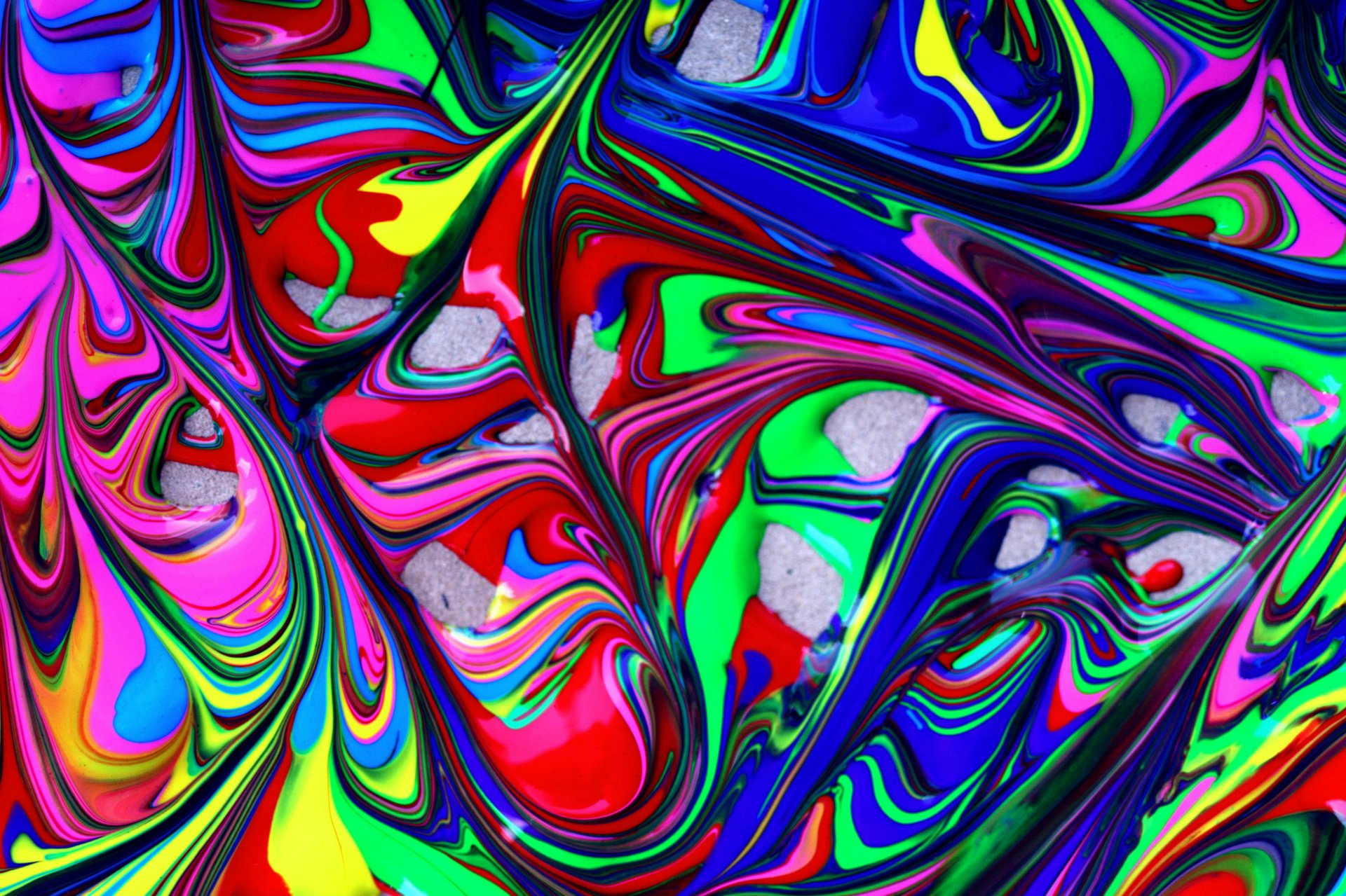 Lively, abstract swirls of color in red, blue, green and yellow.